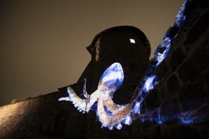 <p>Images of deep sea creatures projected onto a building in Oslo, Norway’s capital city, in November last year in protest against the government’s decision to open up Arctic waters to deep-sea mining (Image © Will Rose / Greenpeace)</p>