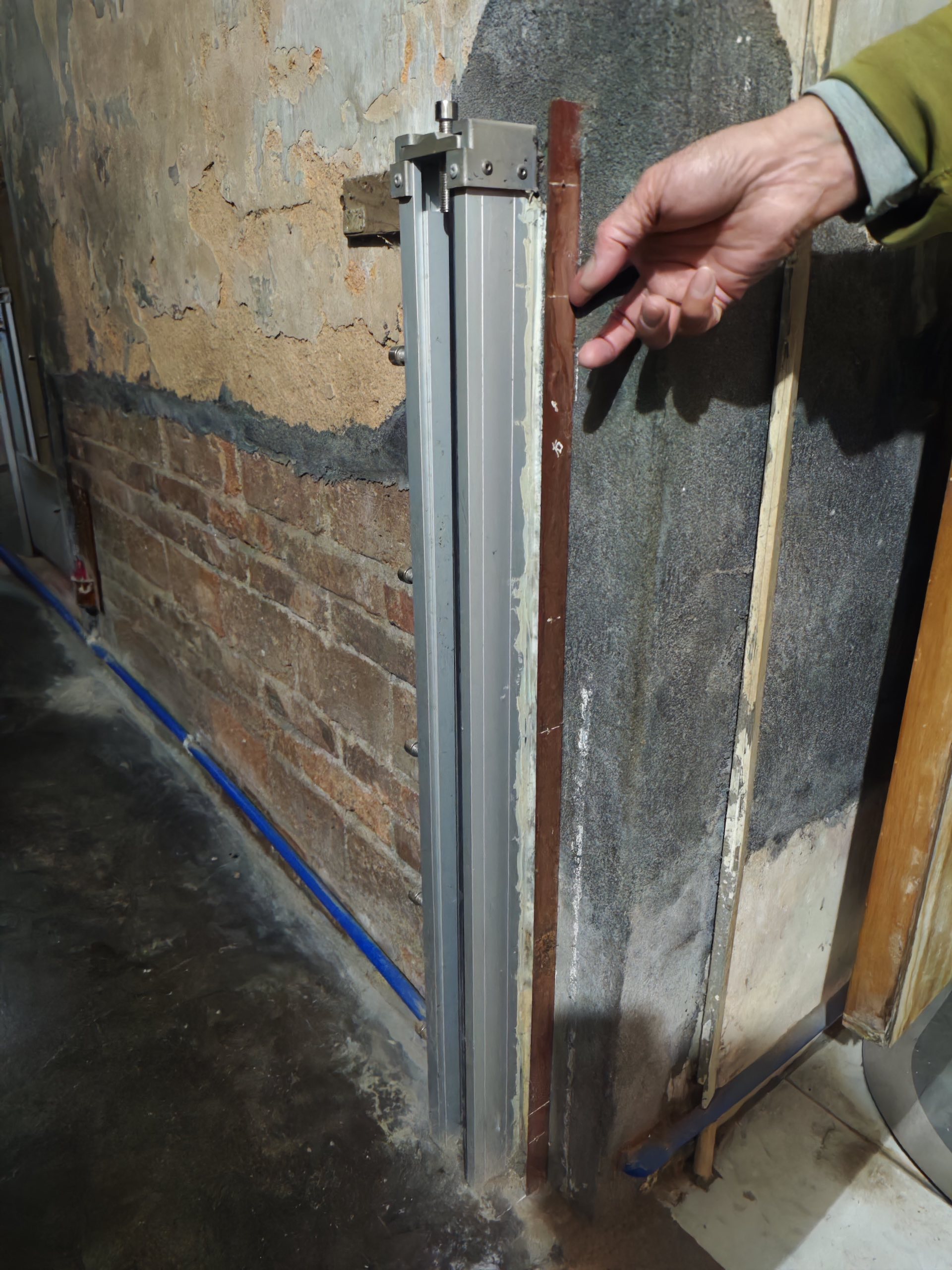 a metal board attaced to the door as flood barriers