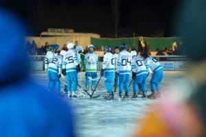 <p>An ice hockey team huddles ahead of a match at the Karakoram Winterlude festival in Moorkhun Gojal, northwestern Pakistan, in January 2024 (Image: Sajjad Ullah Baig / SCARF)</p>
