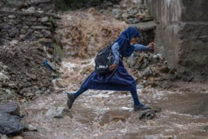 <p>A flooded road on the outskirts of Srinagar, Kashmir after a cloudburst in July 2023. The Kashmir region is particularly vulnerable to the effects of glaciers melting due to climate change. (Image: Dar Yasin / AP via Alamy)</p>