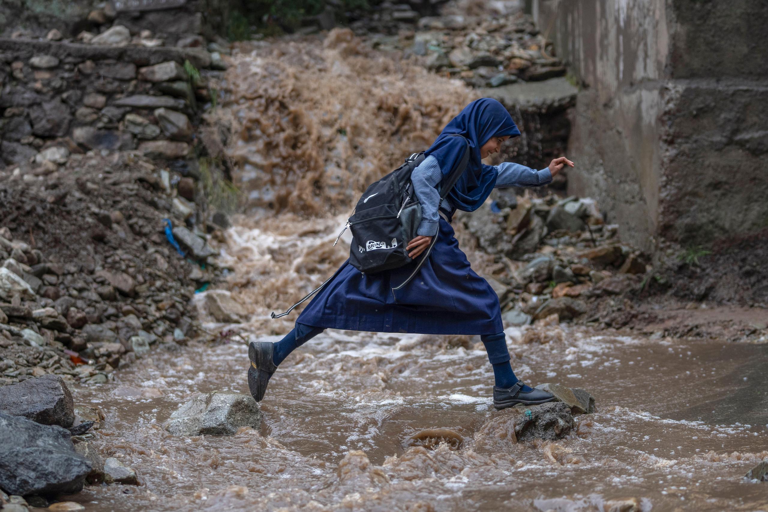 <p>A flooded road on the outskirts of Srinagar, Kashmir after a cloudburst in July 2023. The Kashmir region is particularly vulnerable to the effects of glaciers melting due to climate change. (Image: Dar Yasin / AP via Alamy)</p>