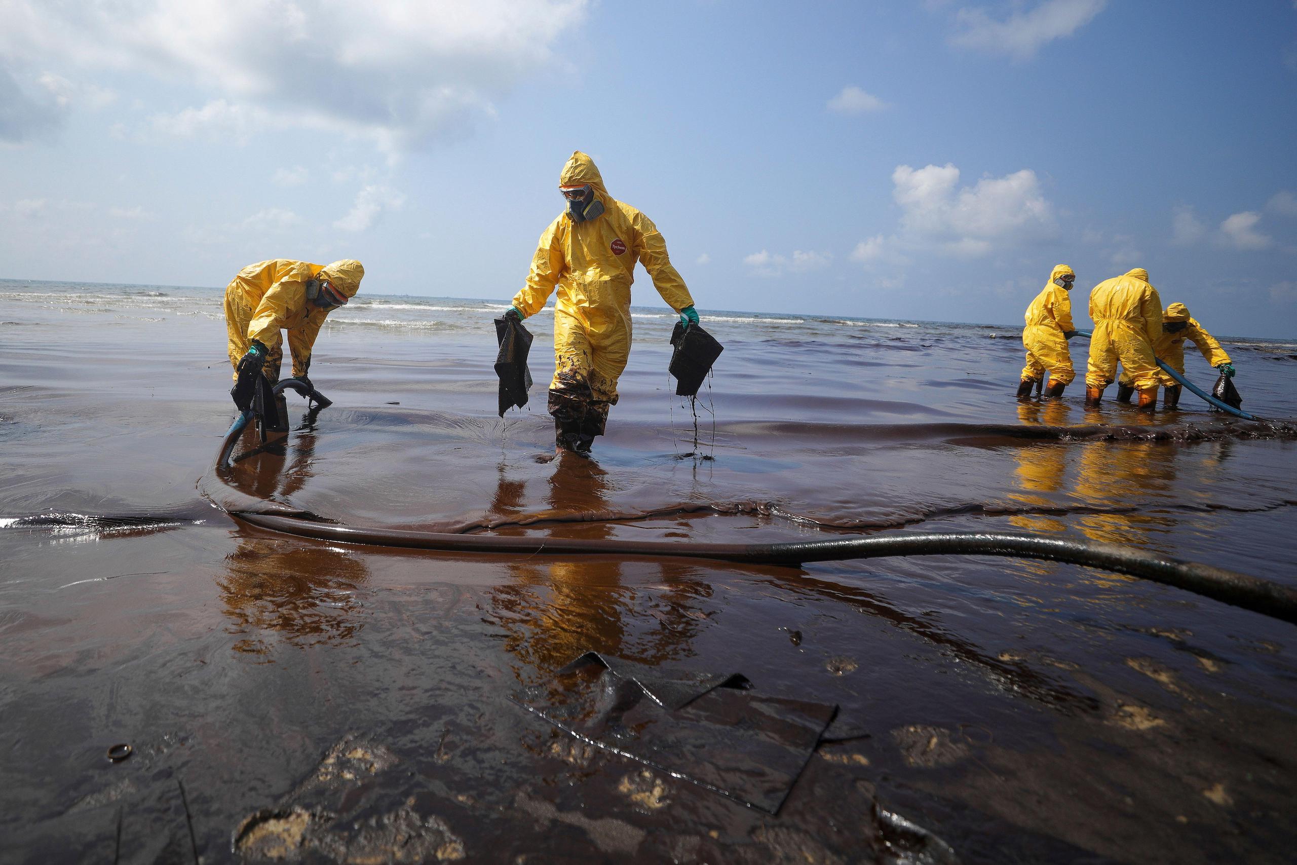 <p>A clean-up operation at Mae Ramphueng Beach, Thailand, after 47,000 tons of crude oil leaked from an undersea pipeline off the coast in January 2022 (Image: Nava Sangthong / Alamy)</p>