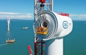 Workers installing an offshore wind turbine