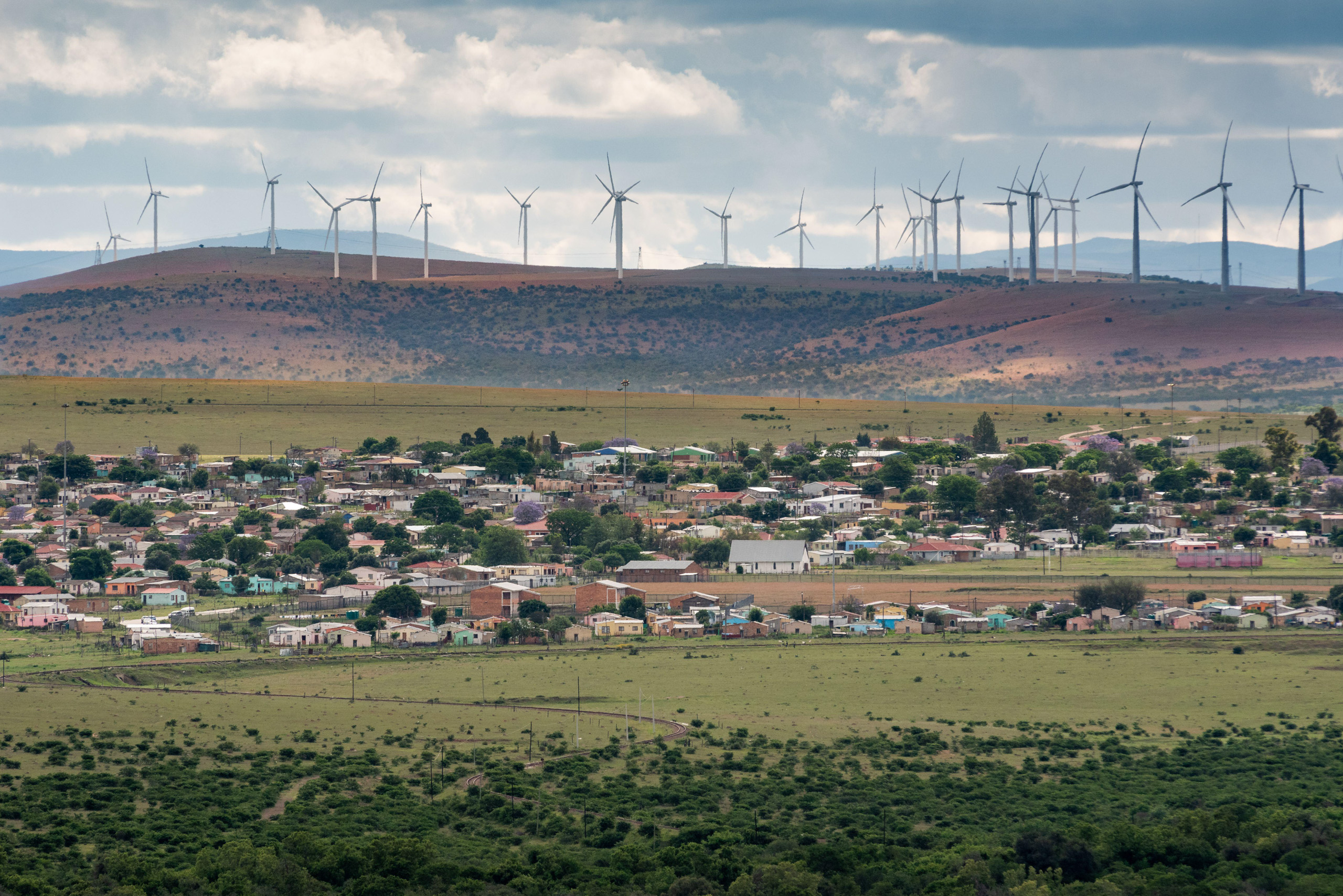 <p>Wind turbines overlooking the village of Bedford in Eastern Cape, South Africa (Image: Harold Gess / Alamy)</p>
