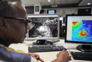 <p>An Indian Meteorological Department employee in New Delhi monitors Cyclone Vayu before its landfall in the western Indian state of Gujarat in June 2019 (Image: Rishabh R Jain / Alamy)</p>