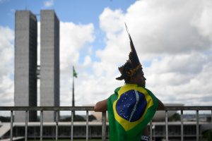 <p>A man at an Indigenous rights protest in Brasília in April 2019. Brazil is one of the deadliest countries in Latin America for environmental defenders, but has yet to ratify the Escazú Agreement. (Image: Mateus Bonomi / Alamy)</p>