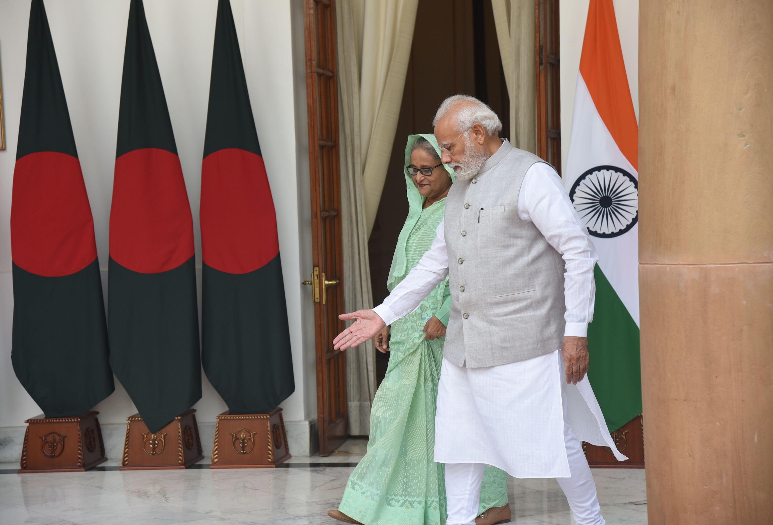 Prime Minister Narendra Modi with Bangladesh counterpart Sheikh Hasina on their way for a bilateral talks