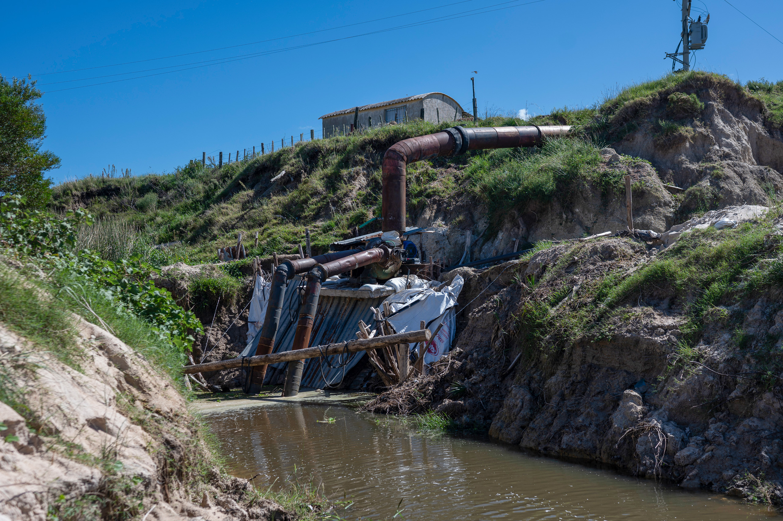 large pipes feeding into narrow waterway