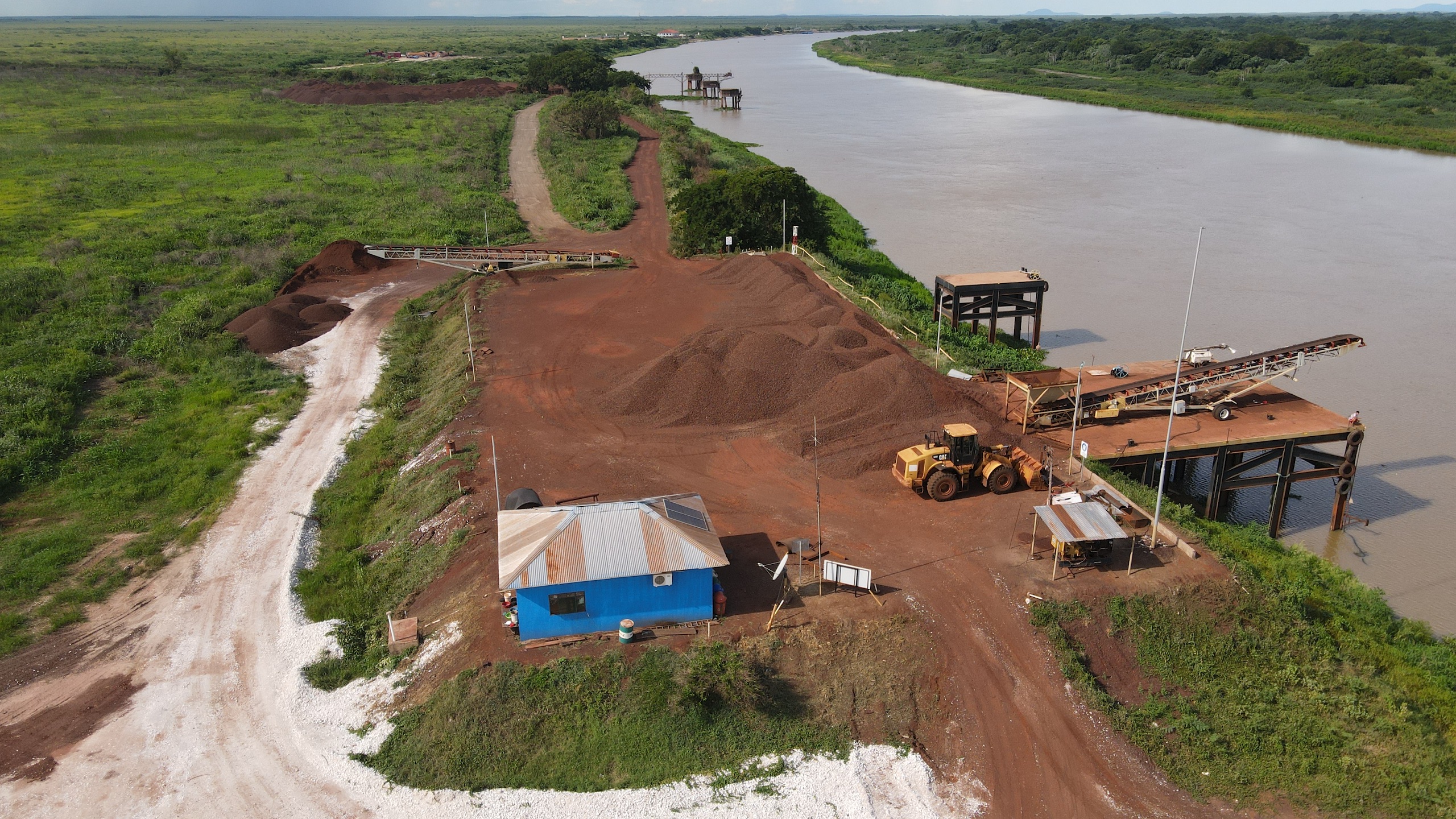An aerial view of a river winding through a construction site