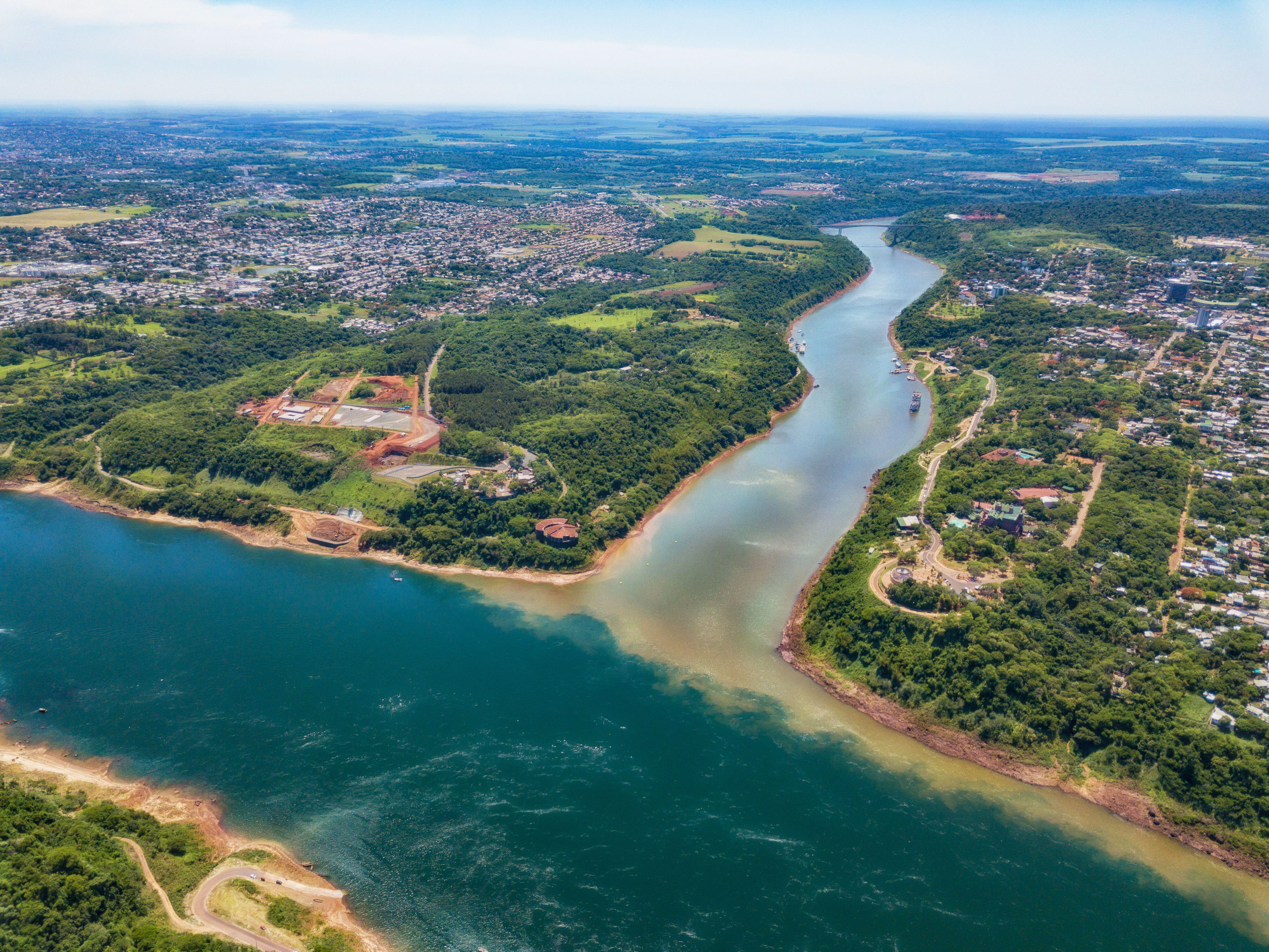 <p>The Paraná River is at the “triple frontier” between the cities of Presidente Franco in Paraguay, Foz do Iguaçu in Brazil, and Puerto Iguazú in Argentina. The river forms part of a waterway that is an important route for international trade. (Image: Jan Schneckenhaus / Alamy)</p>