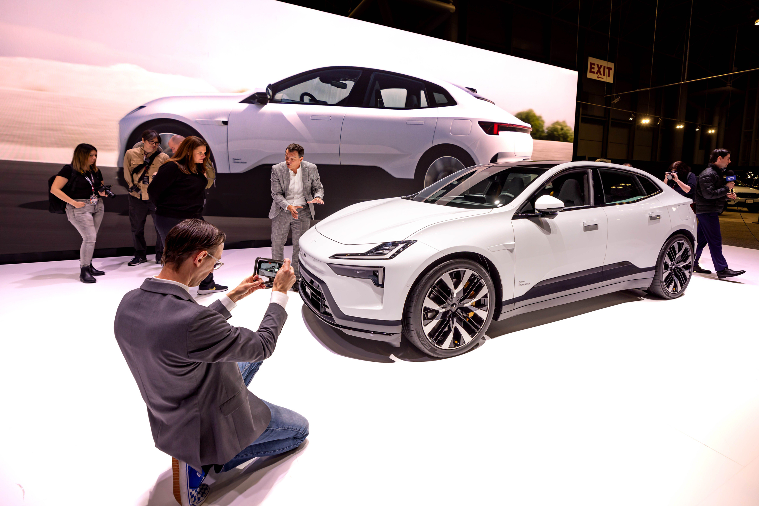 <p>Visitors view electric cars on display at the 2024 New York International Auto Show (Image: Michael Nigro / Sipa US / Alamy)</p>