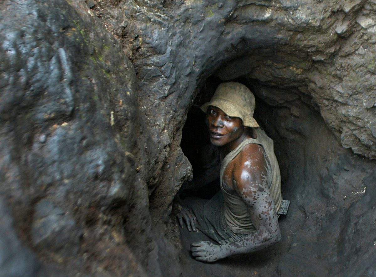 muddy man in narrow tunnel
