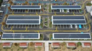 Aerial view of vehicles at solar-powered charging station