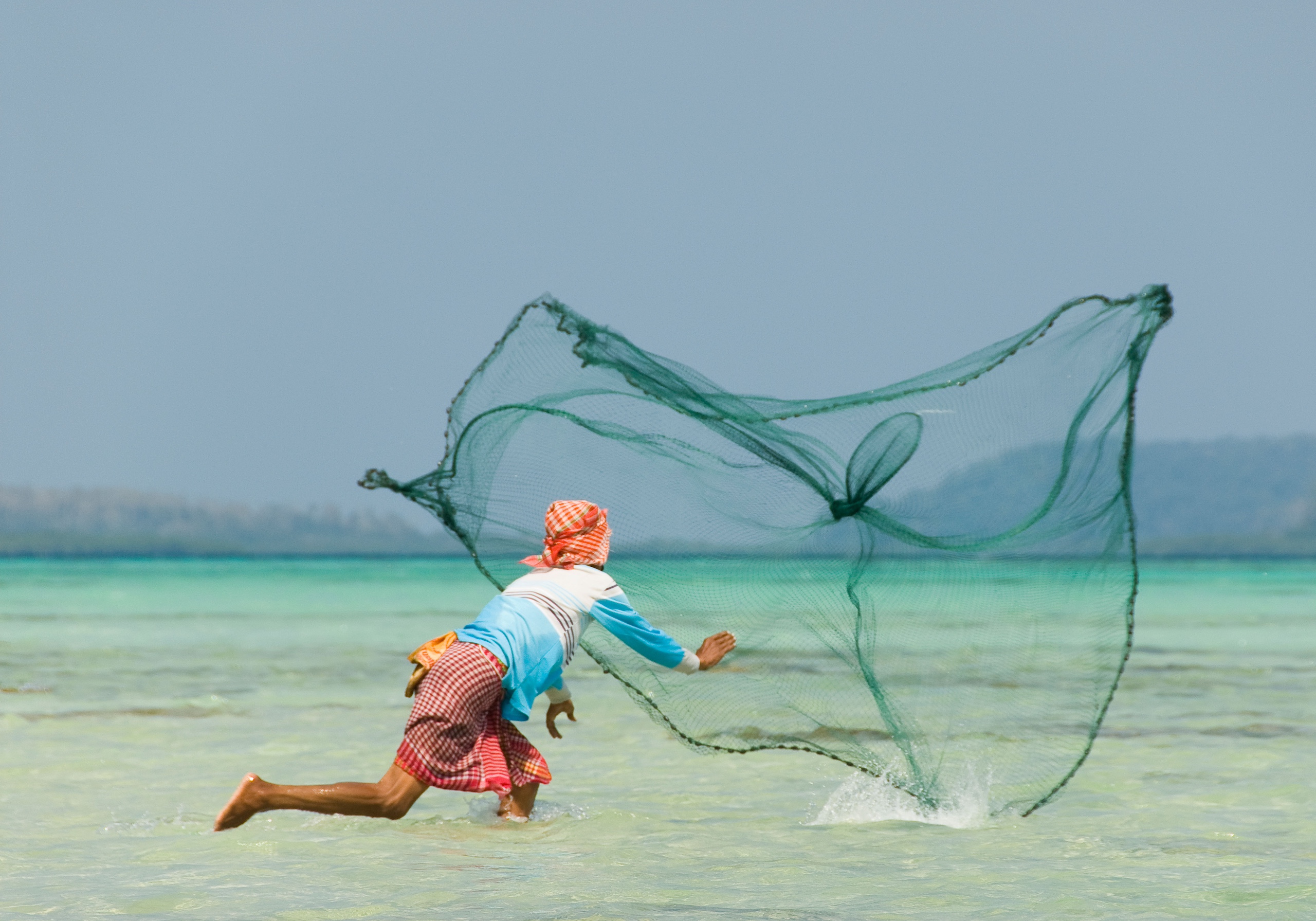 <p>A fisherman casts his net wide in the Andaman Sea. Despite being surrounded by water, freshwater is in short supply across the 836 islands that make up the Andaman Islands archipelago (Image: David Pearson / Alamy).</p>
