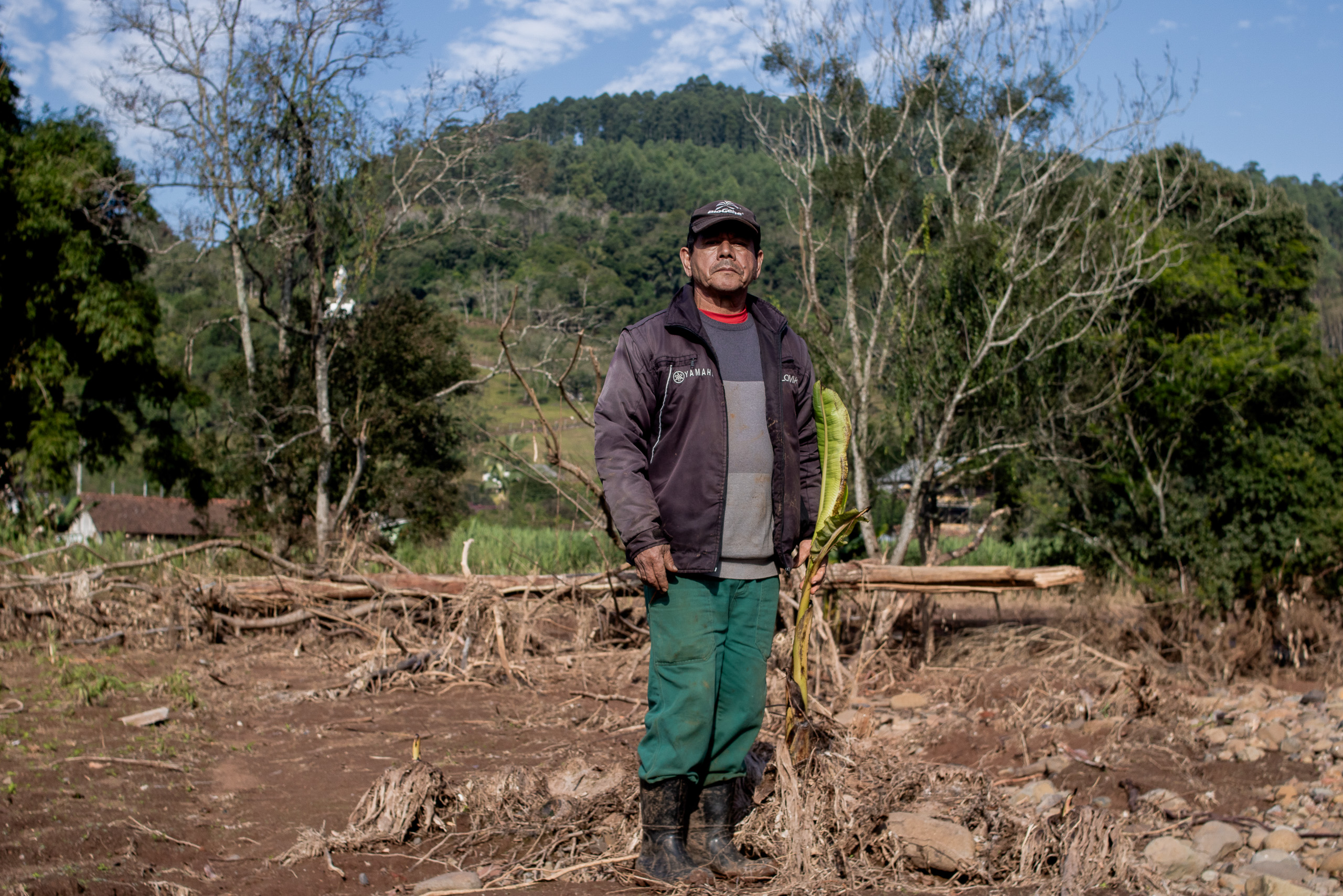 man with muddy boots standing outside