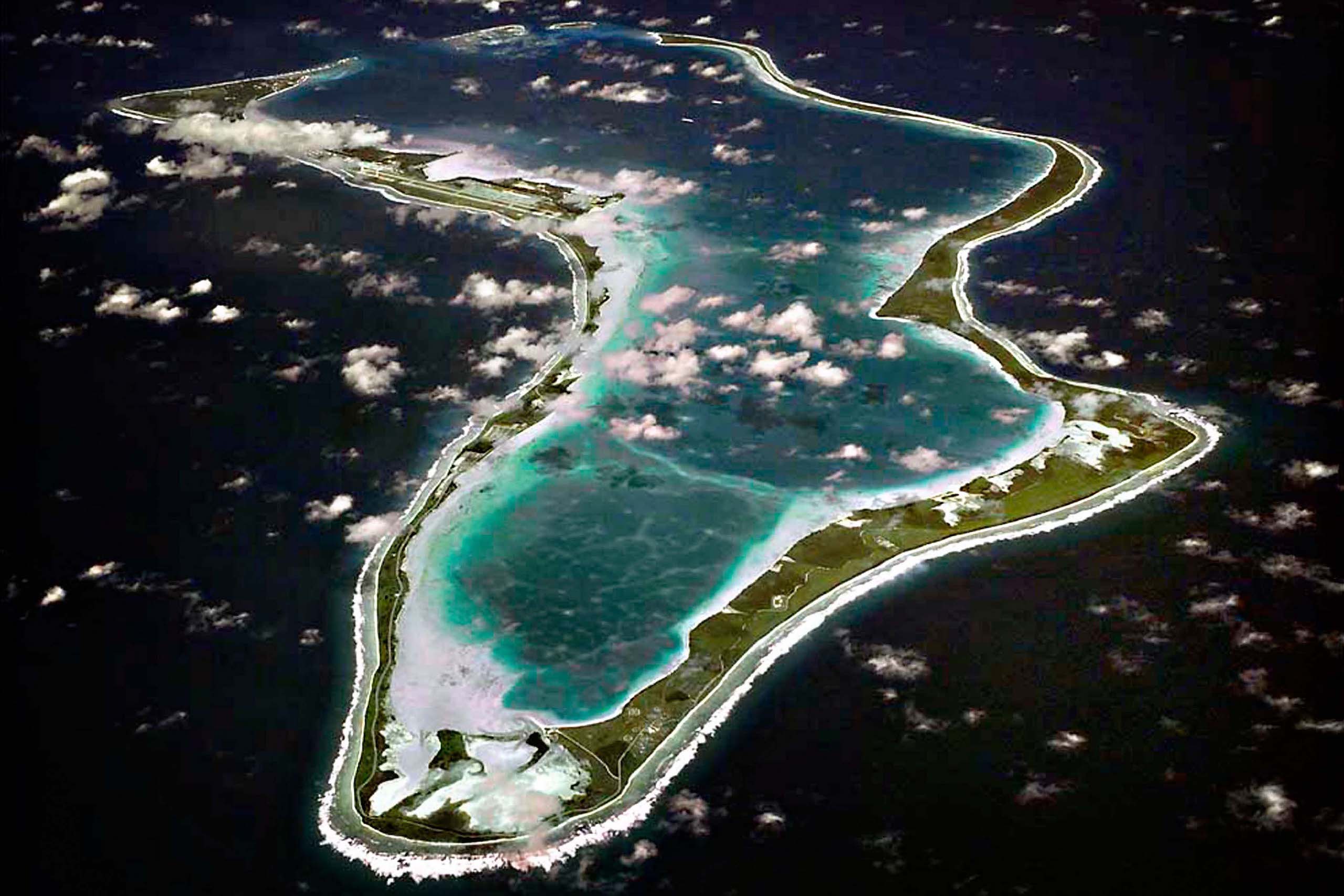 <p>Diego Garcia, pictured here in 2013, is the largest island in the Chagos Archipelago. The expulsion of local people to make way for a military base triggered an ongoing controversy that has marred efforts to protect marine life (Image: US Navy Photo / Alamy)</p>