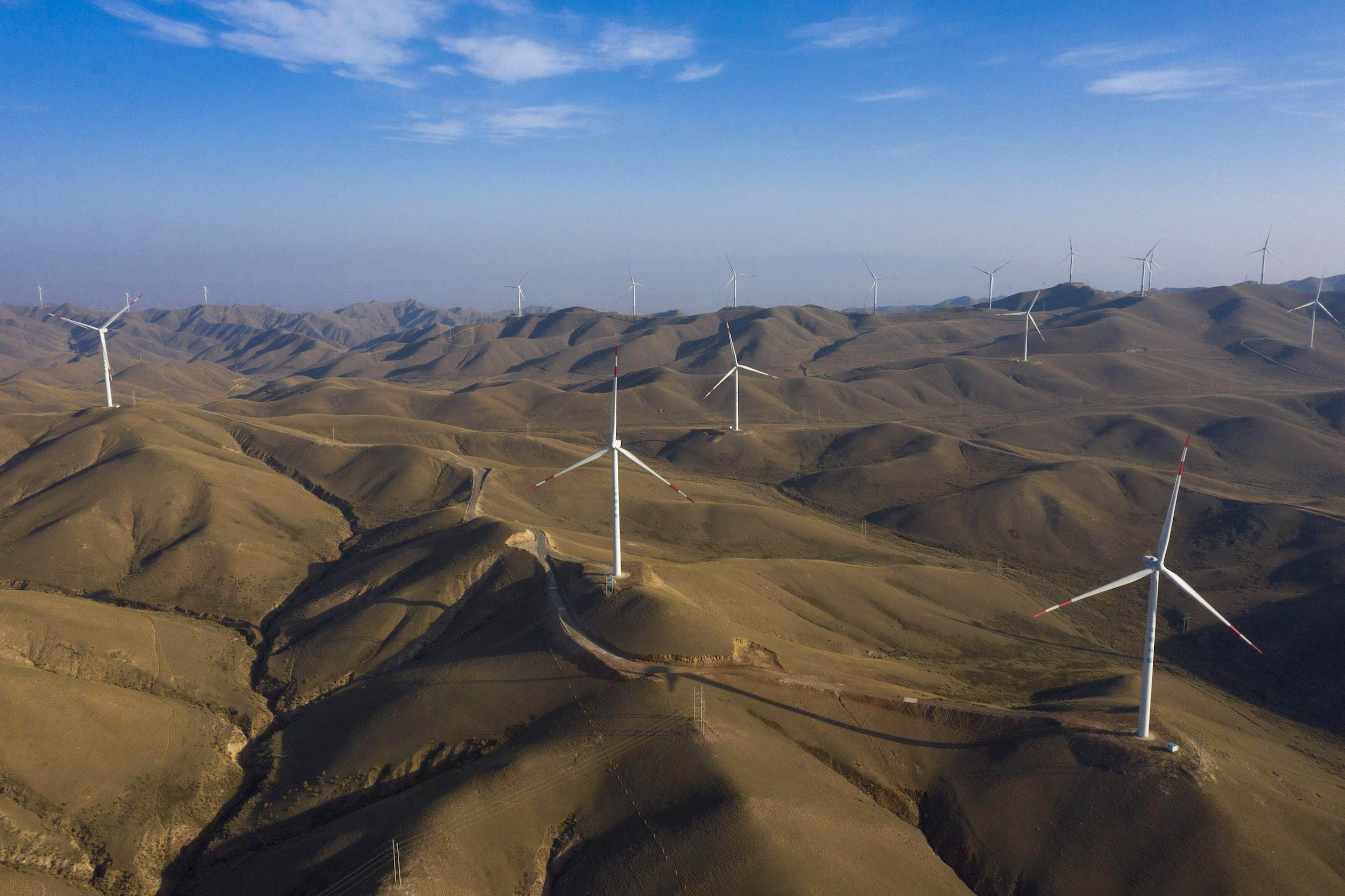 <p>Wind turbines in Gansu province. The NGO Friends of Nature recently <a href="https://climatecasechart.com/non-us-case/the-friends-of-nature-institute-v-gansu-state-grid/">won</a> a case against Gansu State Grid, forcing the state-owned enterprise to invest in and transition to renewable energy (Image: Imaginechina / Alamy)</p>