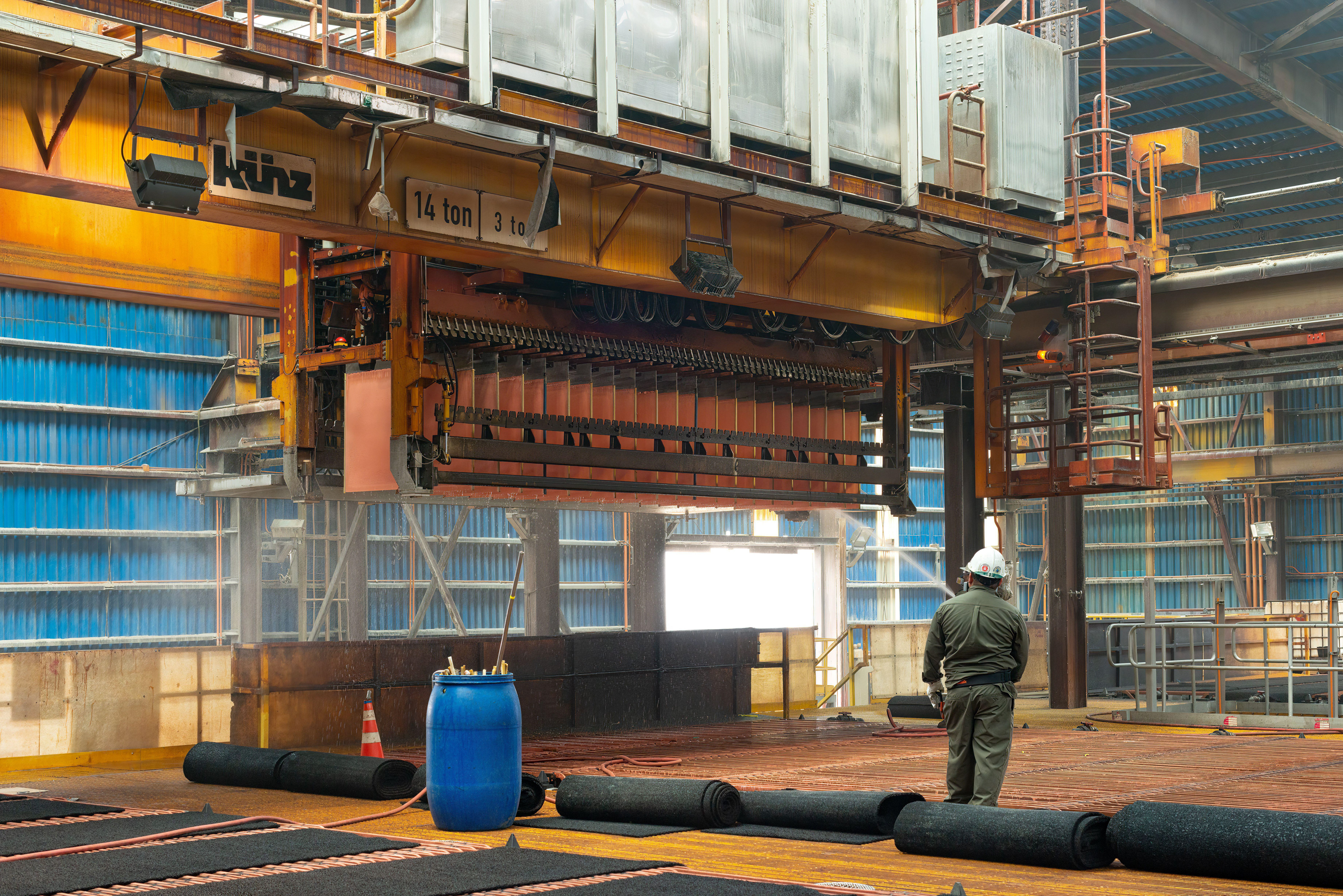 worker washes copper cathodes