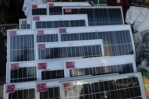 solar panels on display with stickers denoting wattage