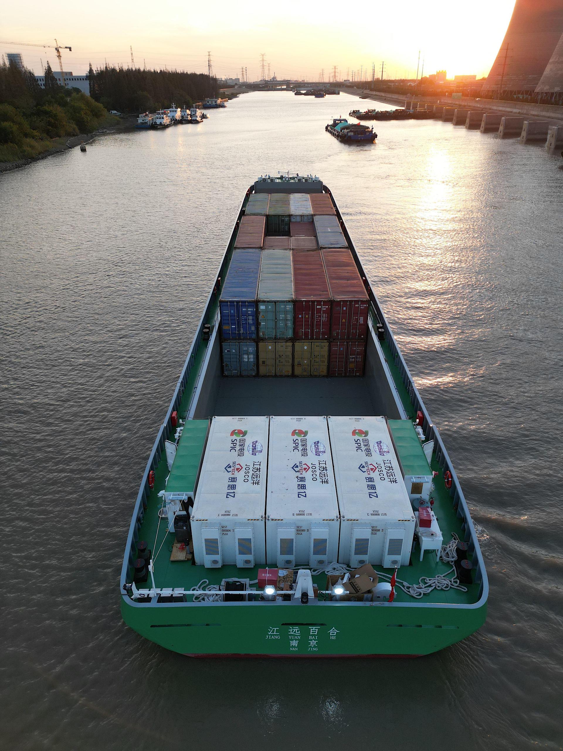 A large cargo ship navigating through the river