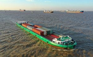 A large cargo ship navigating through the river