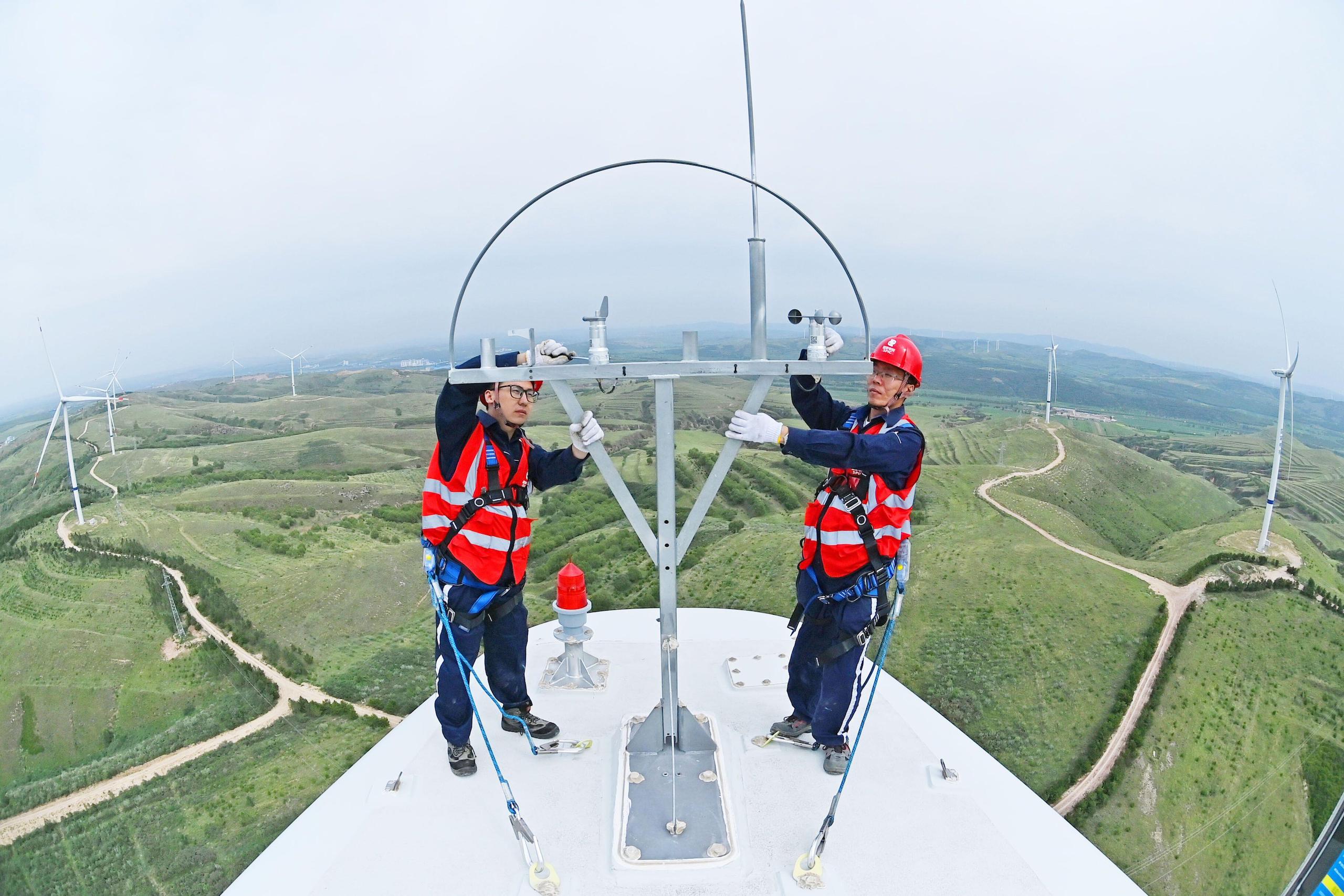 <p>Ganquanshan wind farm in Shuozhou city, Shanxi province. By the end of 2023, China had 15 times the renewable generation capacity of a decade previously. Experts say the country can now be bolder with the scope and ambition of its climate targets (Image: Cynthia Lee / Alamy)</p>