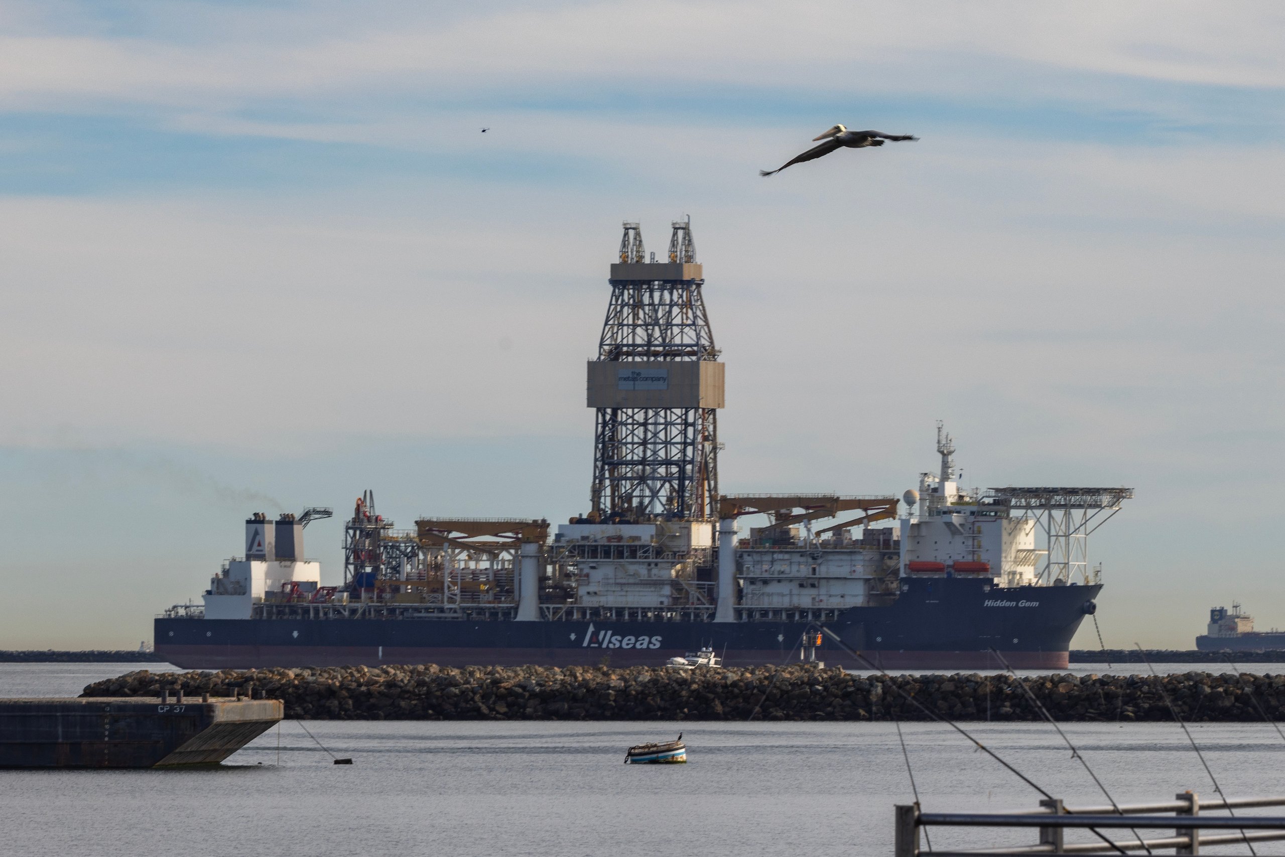 A massive drill ship towering over the water