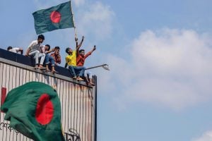 a group of young people waving flags