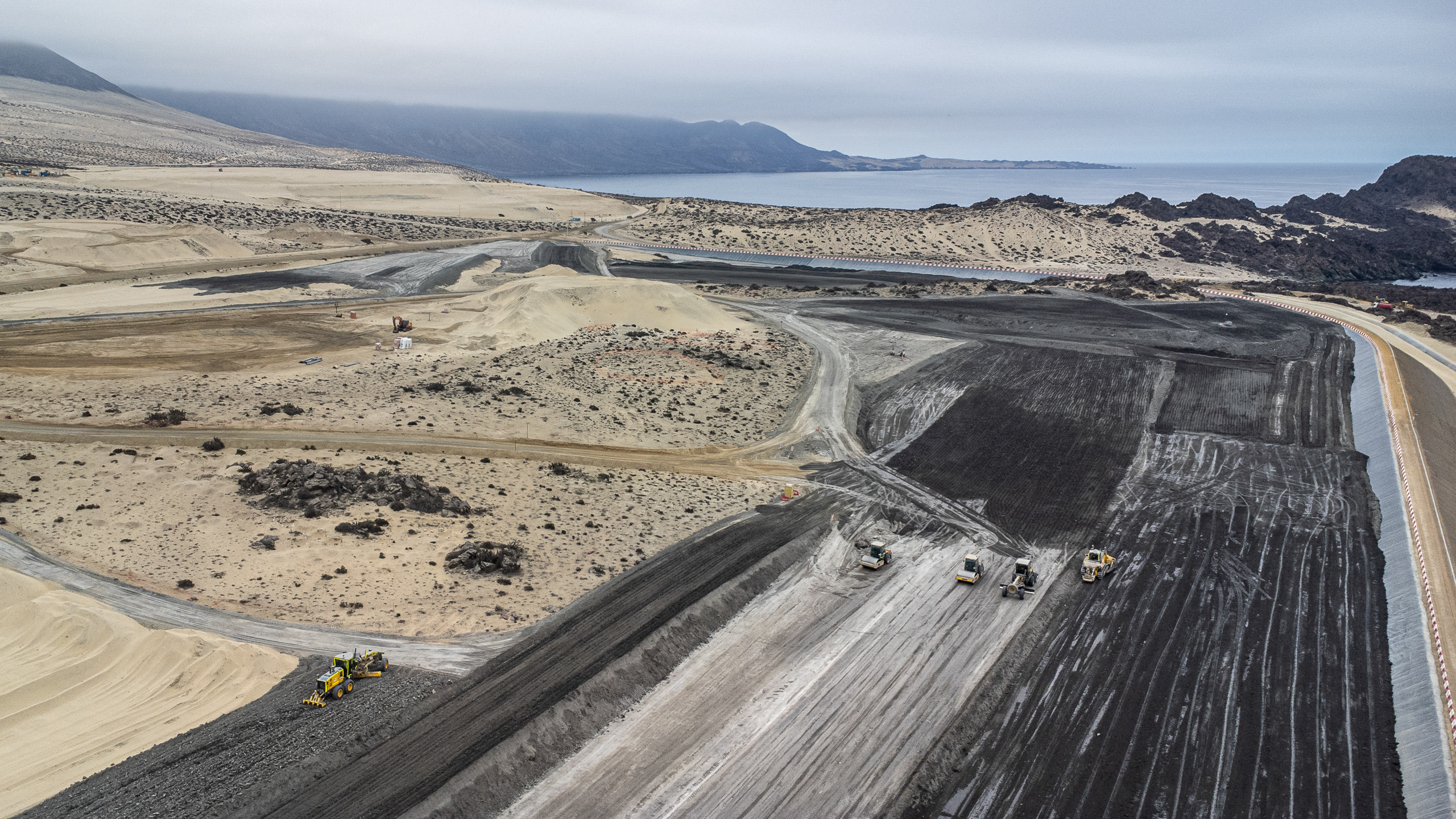 large open tract of land with dark tracks