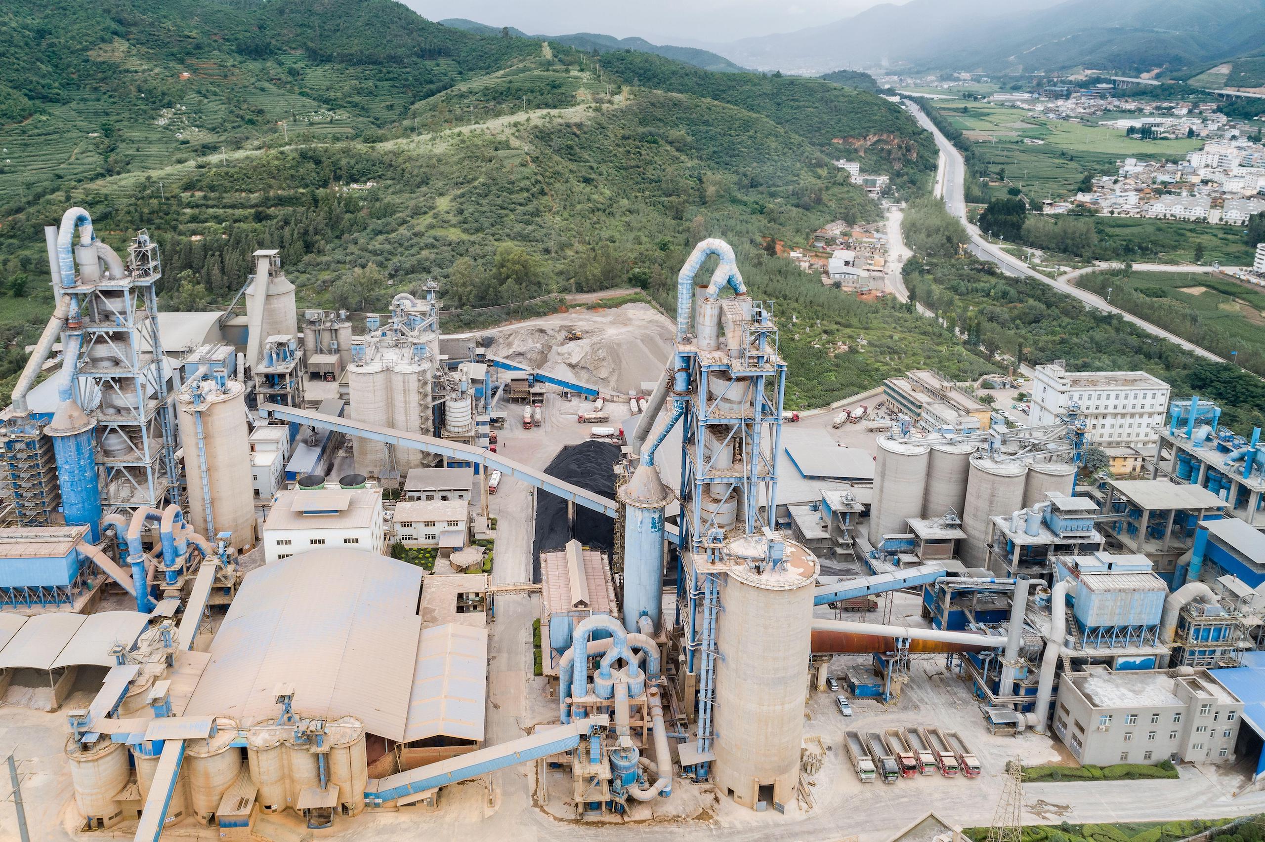 <p>A cement plant in Yunnan province. Work on bringing the steel, cement, and aluminium industries into China’s mandatory carbon market is speeding up (Image: Yibo Wang / Alamy)</p>