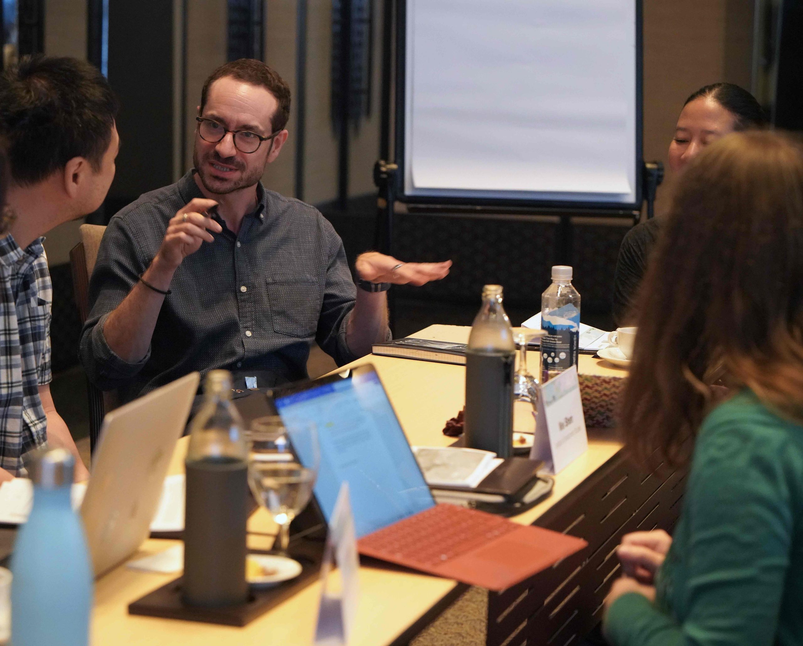 A man dressed speaks at a conference