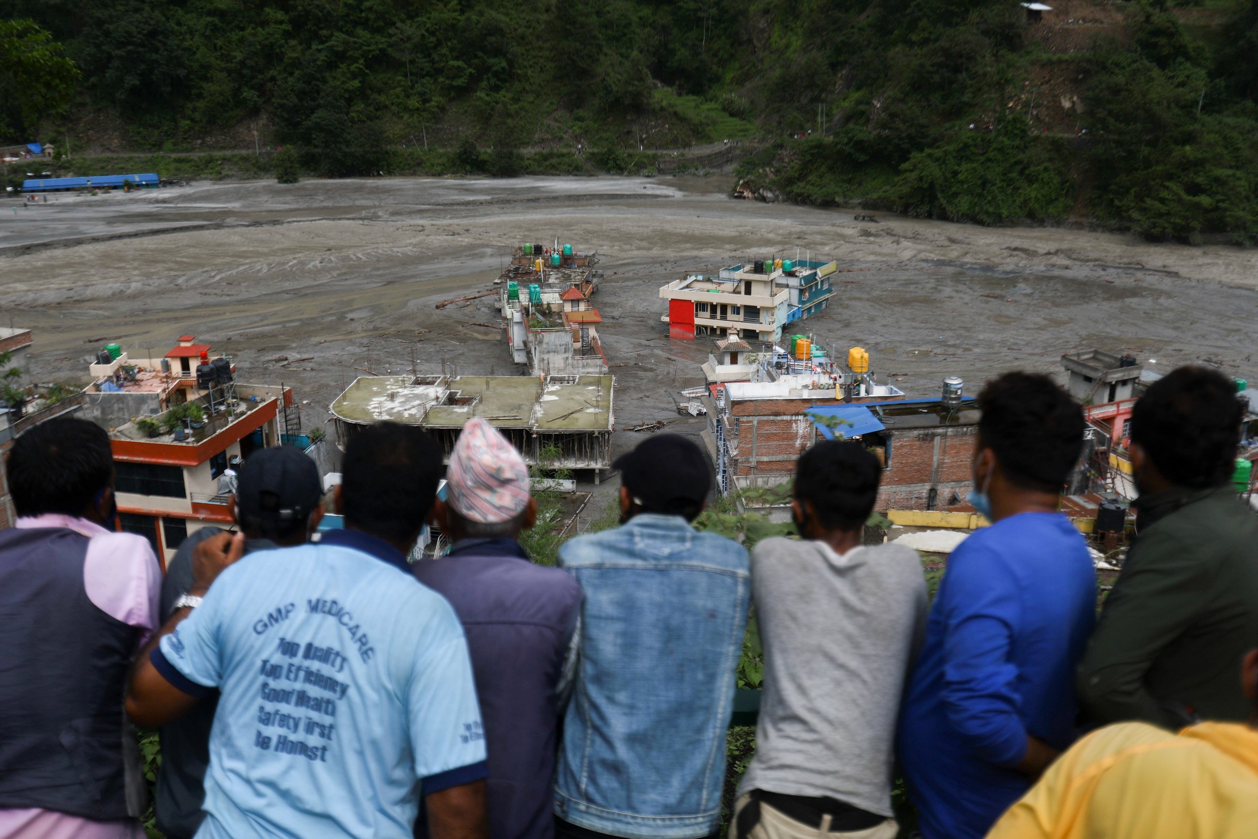 <p class="p1">Residents survey the floodwaters from the swollen Melamchi River, which submerged homes in Sindhupalchok in 2021, causing widespread community losses (Image: Saroj Baizu/NurPhoto)</p>