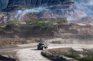 heavy vehicle on road near open mine