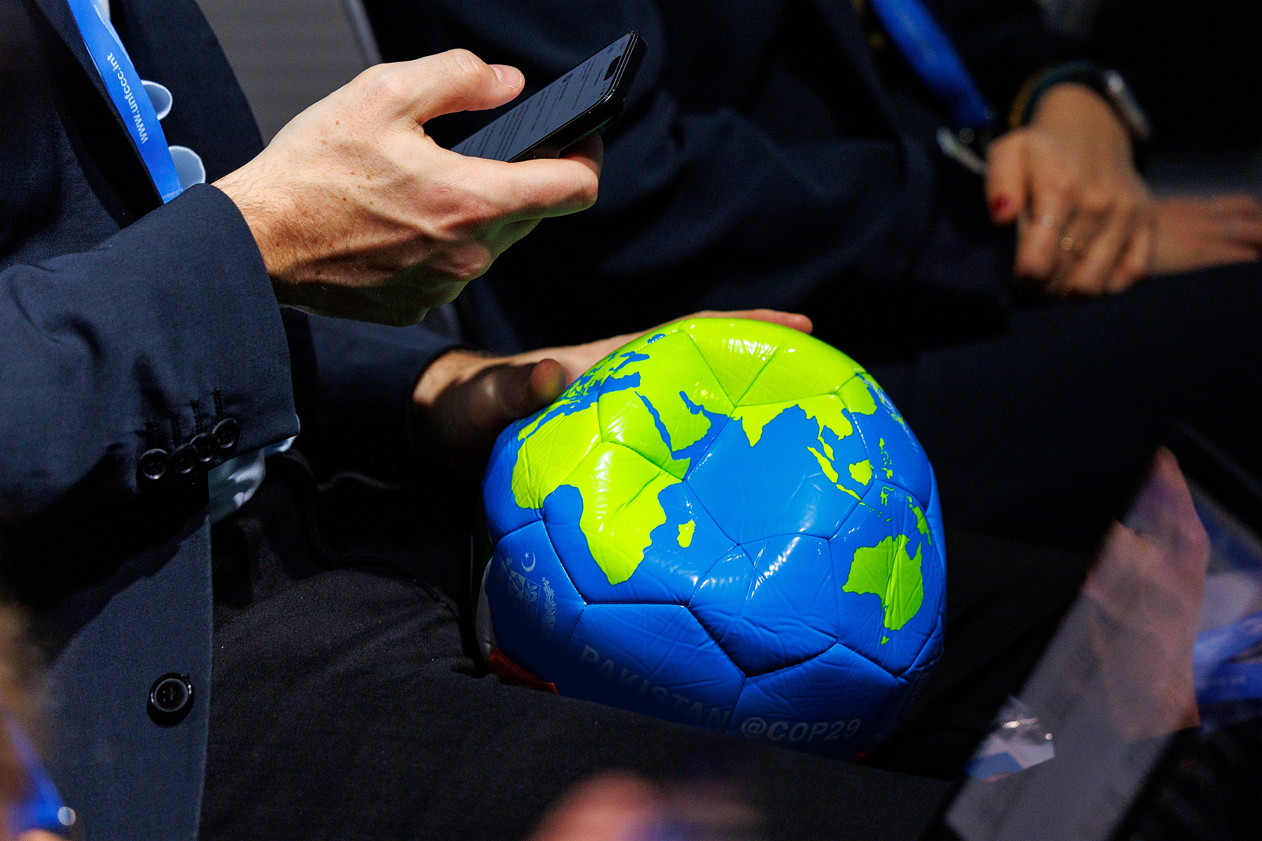 <p>A delegate holds a deflated football during an event on sport and climate change at COP29 in Baku, Azerbaijan. Former COP president Manuel Pulgar-Vidal told Dialogue Earth of a need to move from voluntary commitments towards mandatory actions in UN climate processes (Image: <a href="https://www.flickr.com/photos/unfccc/54148471908/in/album-72177720322018828">Habib Samadov</a> / <a href="https://www.flickr.com/photos/unfccc/">UN Climate Change</a> / <a href="https://creativecommons.org/licenses/by-nc-sa/2.0/">CC BY-NC-SA</a>)</p>