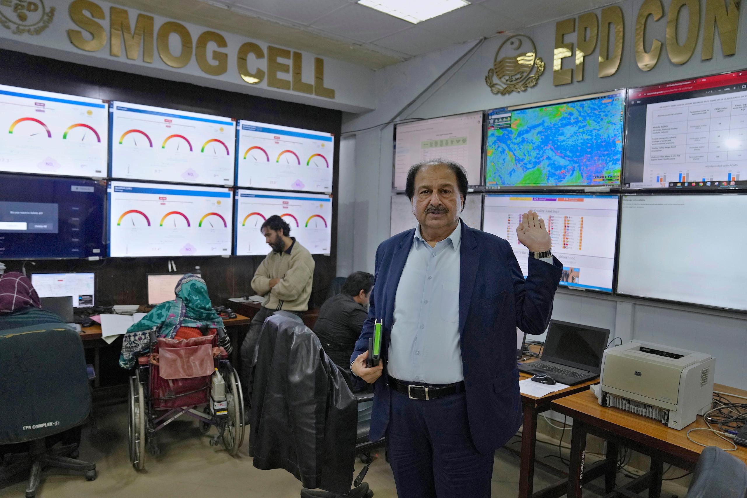 The director of Punjab’s Environment Protection Department, Syed Naseem Ur Rehman Shah, shows off an air quality monitoring room in Lahore. Experts argue the province needs a lot more air monitors to properly study air quality (Image: K M Chaudary / Associated Press / Alamy)