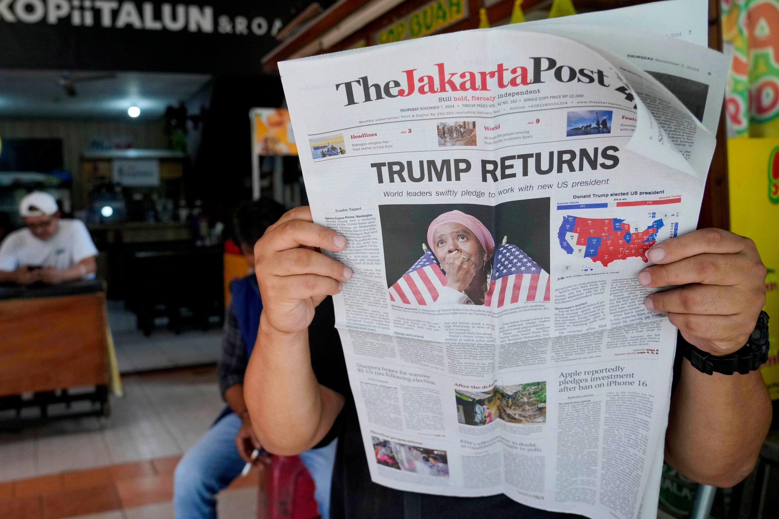 <p>7 November, 2024, Jakarta, Indonesia; a newspaper&#8217;s front-page reports on US election results (Image: Tatan Syuflana / Associated Press / Alamy)</p>