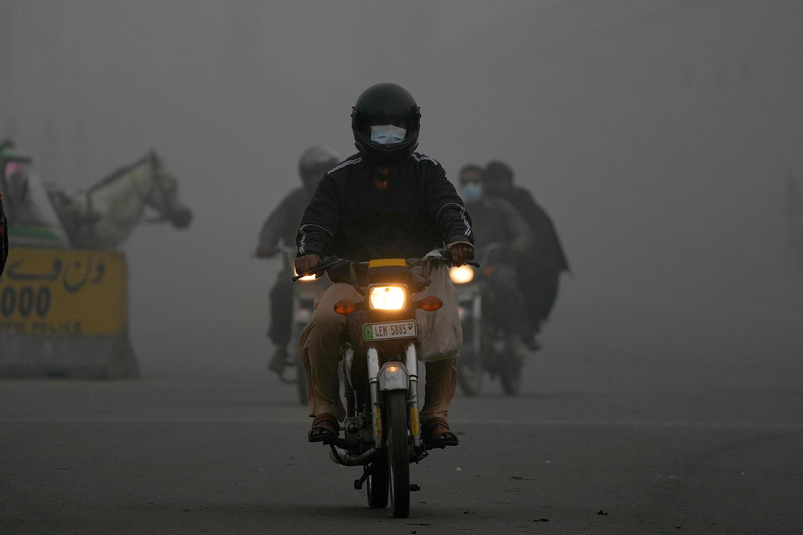 <p>A motorcyclist drives through smog in Pakistan’s capital, Lahore, in early November 2024 (Image: K M Chaudary / Associated Press / Alamy)</p>