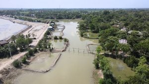 a winding river flowing through a small town