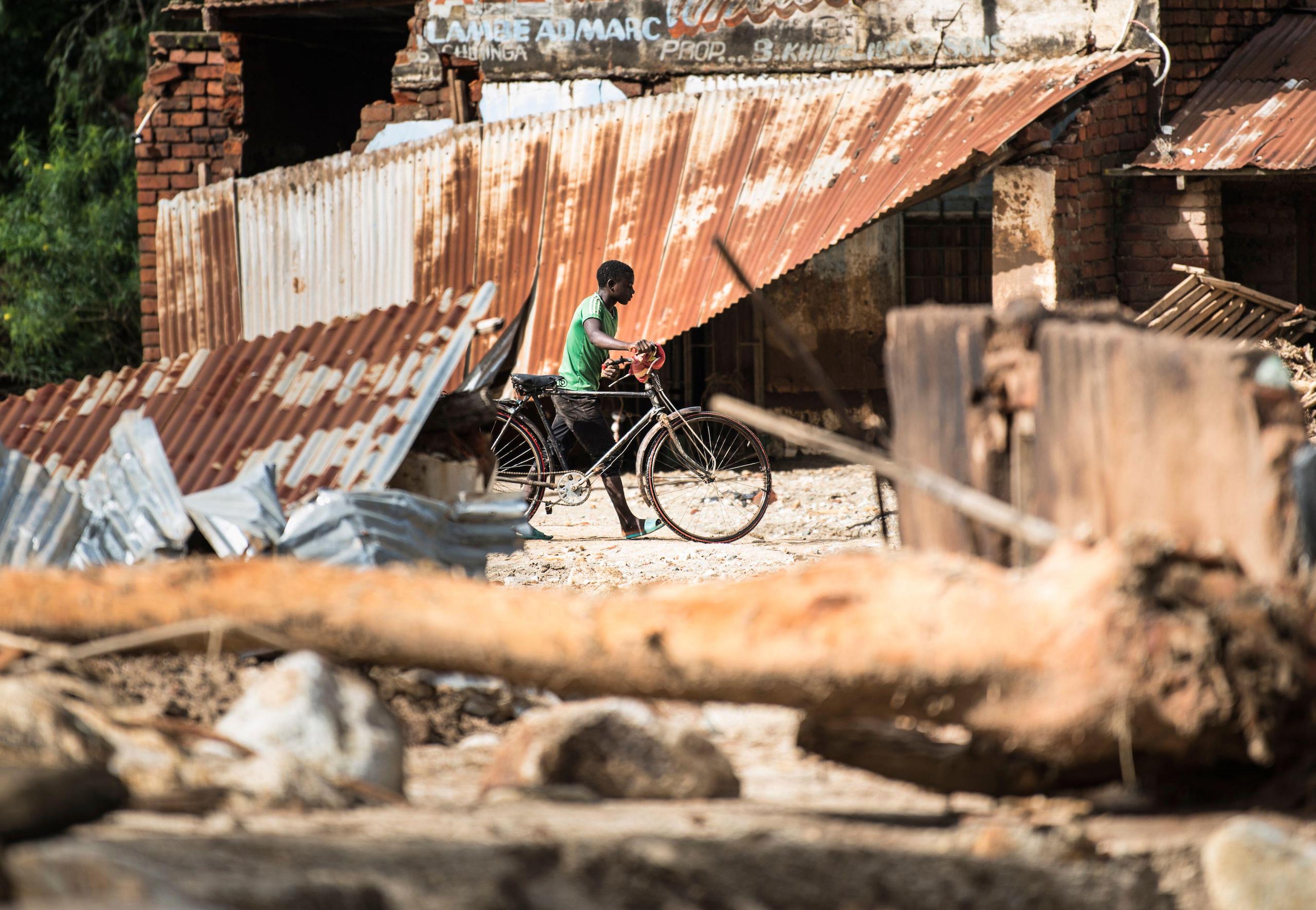 <p>A man surveys damage caused by the heavy rains of Cyclone Freddy, which hit Phalombe in southern Malawi during March 2023 (Image: Thoko Chikondi / Associated Press / Alamy)</p>