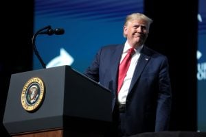 Donald Trump leaning away from lectern