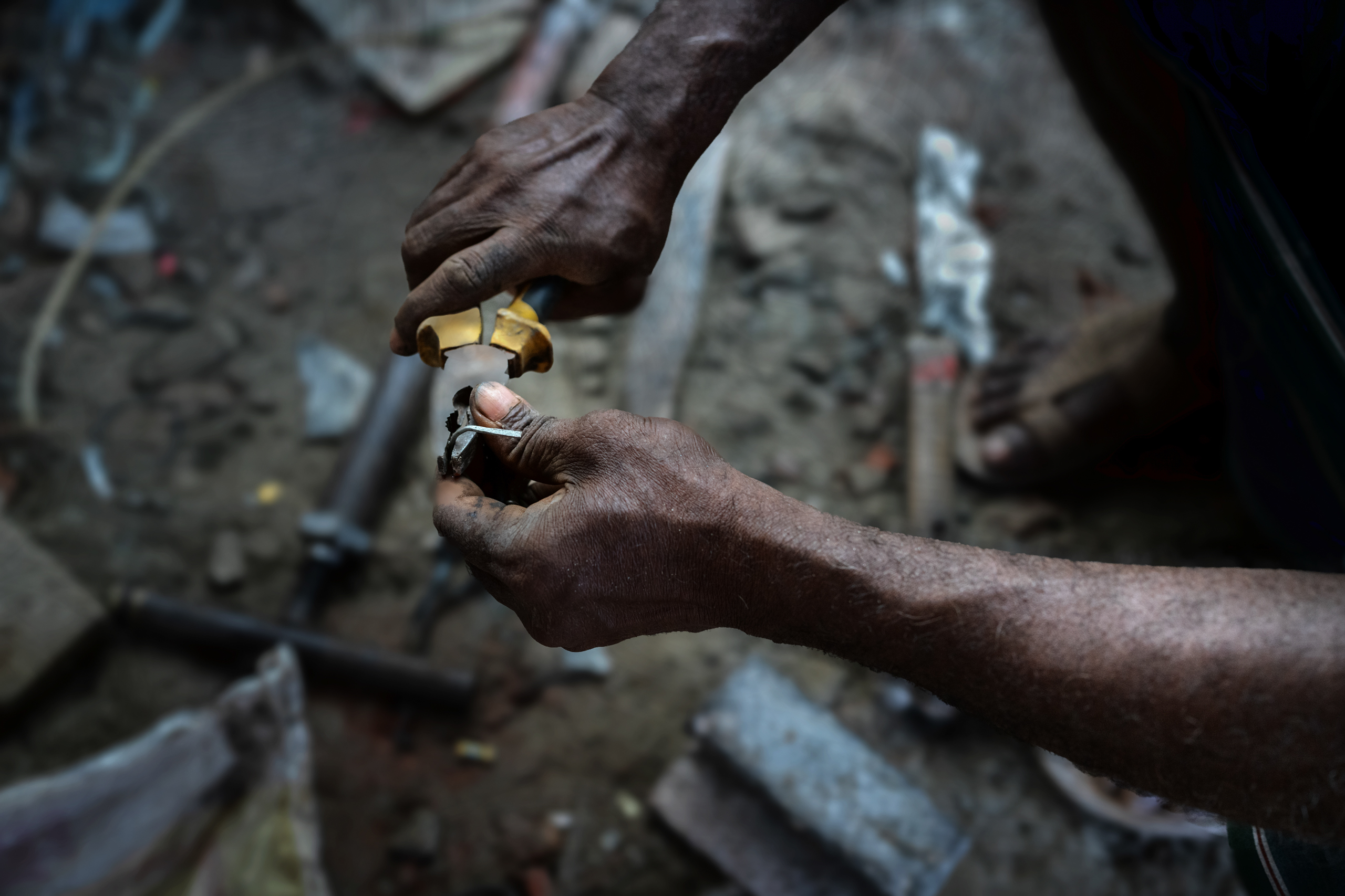 hands holding repair tools