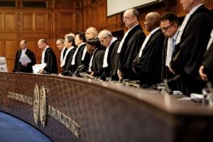 group of judges standing behind long desk