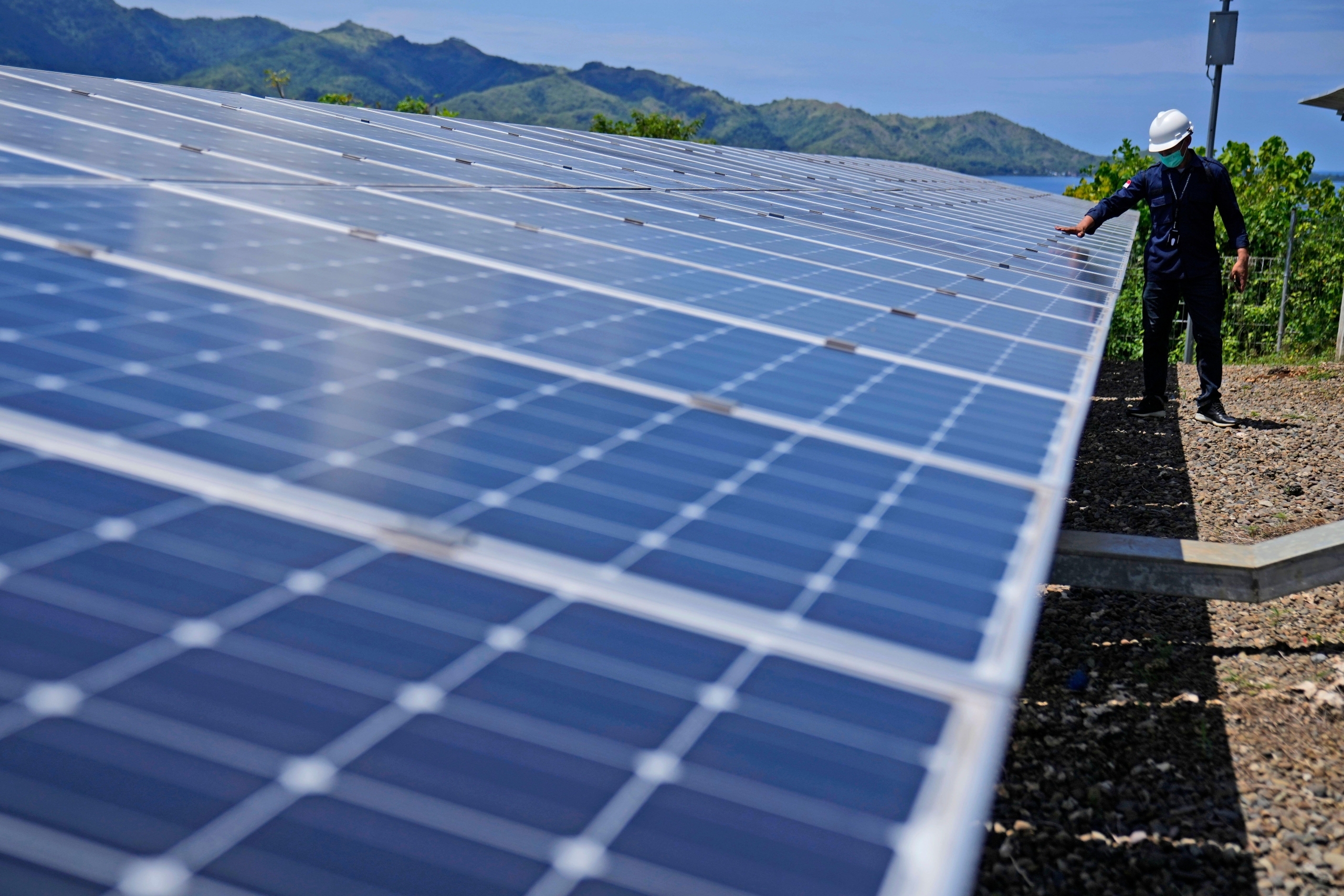 <p>A worker inspects solar panels at a plant on Karampuang Island, in West Sulawesi, Indonesia, 2022. Although investment from China surged under Indonesian President Prabowo Subianto, challenges persist in fully realising the country&#8217;s green potential (Image: Dita Alangkara / AP / Alamy)</p>