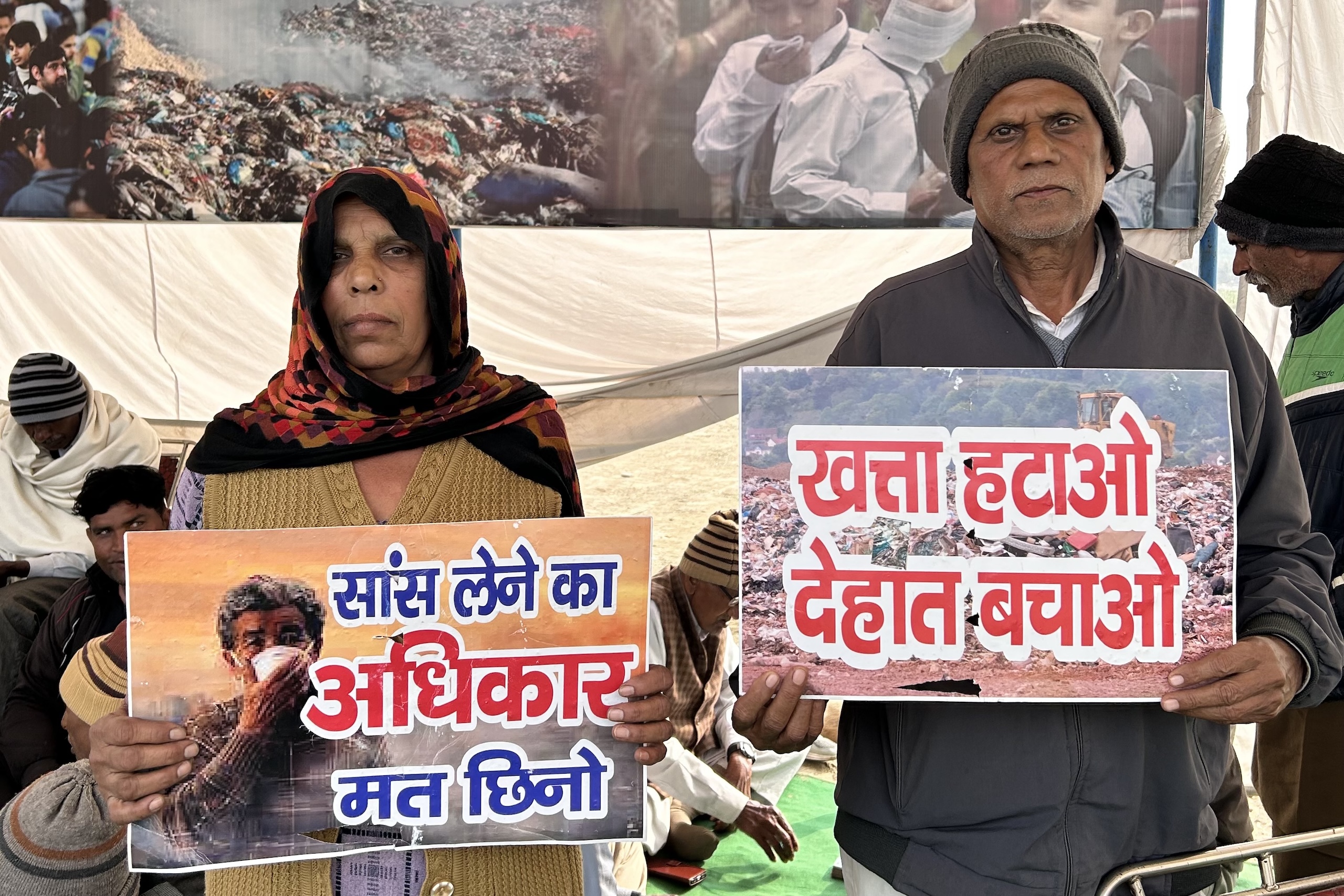 people holding up placcards