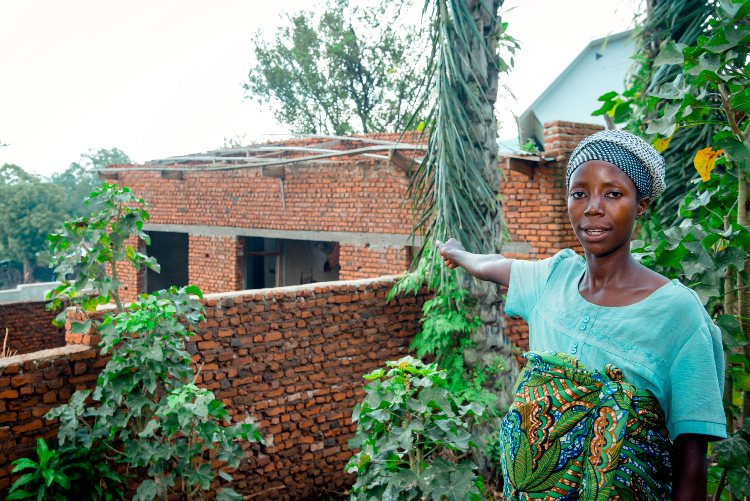 woman standing near low wall