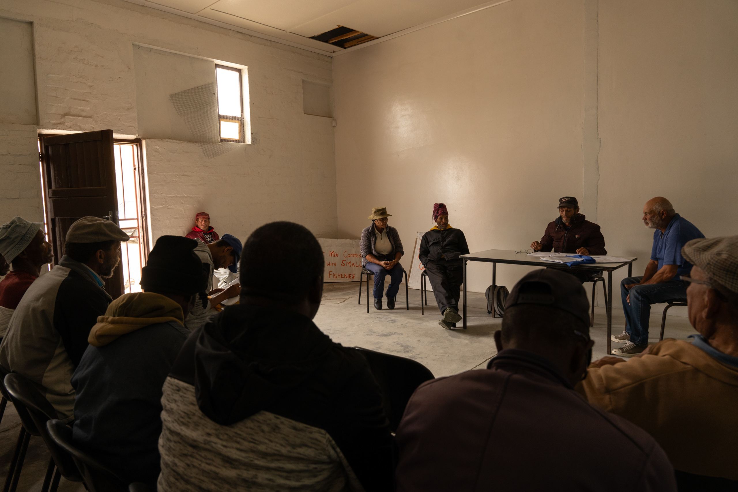 group of people seated in hall
