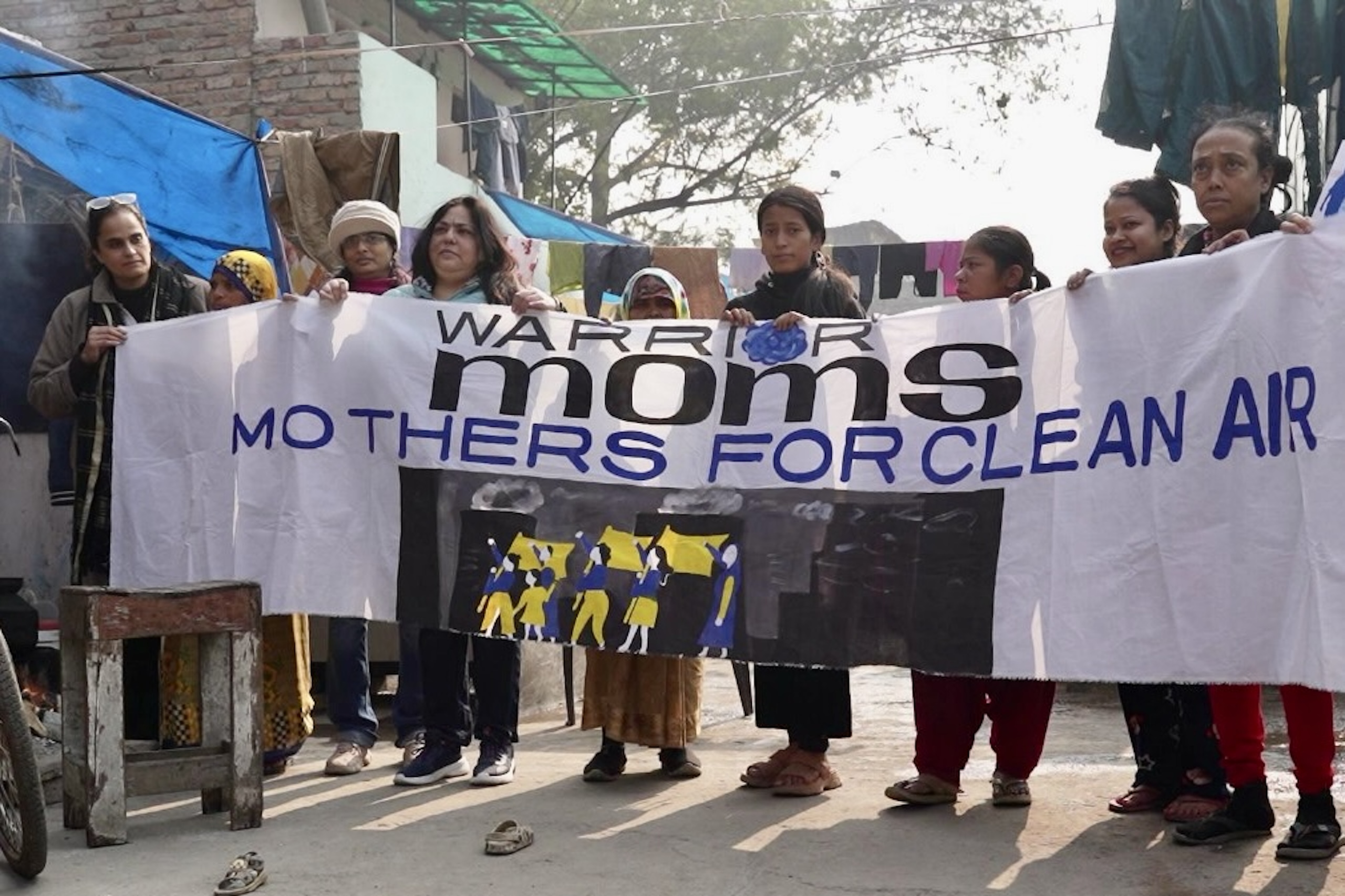 <p>Bhavreen Kandhari (furthest left), along with other Warrior Moms, fighting for clean air for their children in Delhi (Image: Bhavreen Kandhari / Warrior Moms)</p>