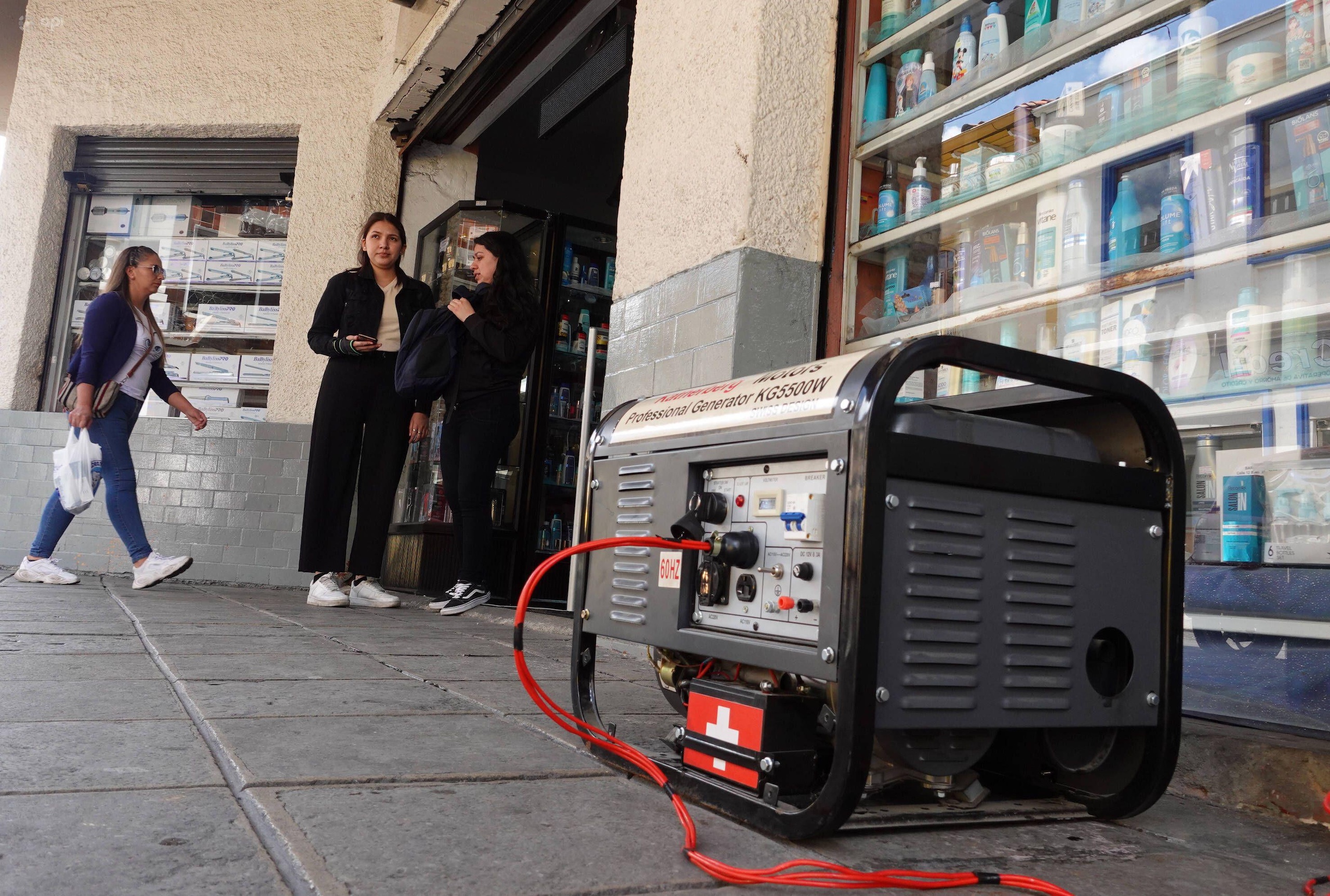 a diesel generator on the floor outside a shop