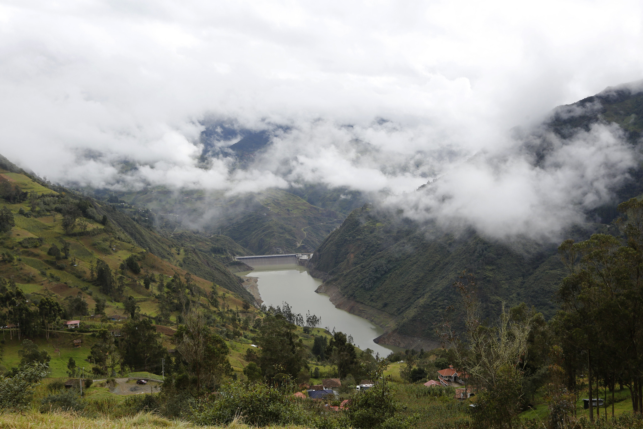 dammed river between green hills