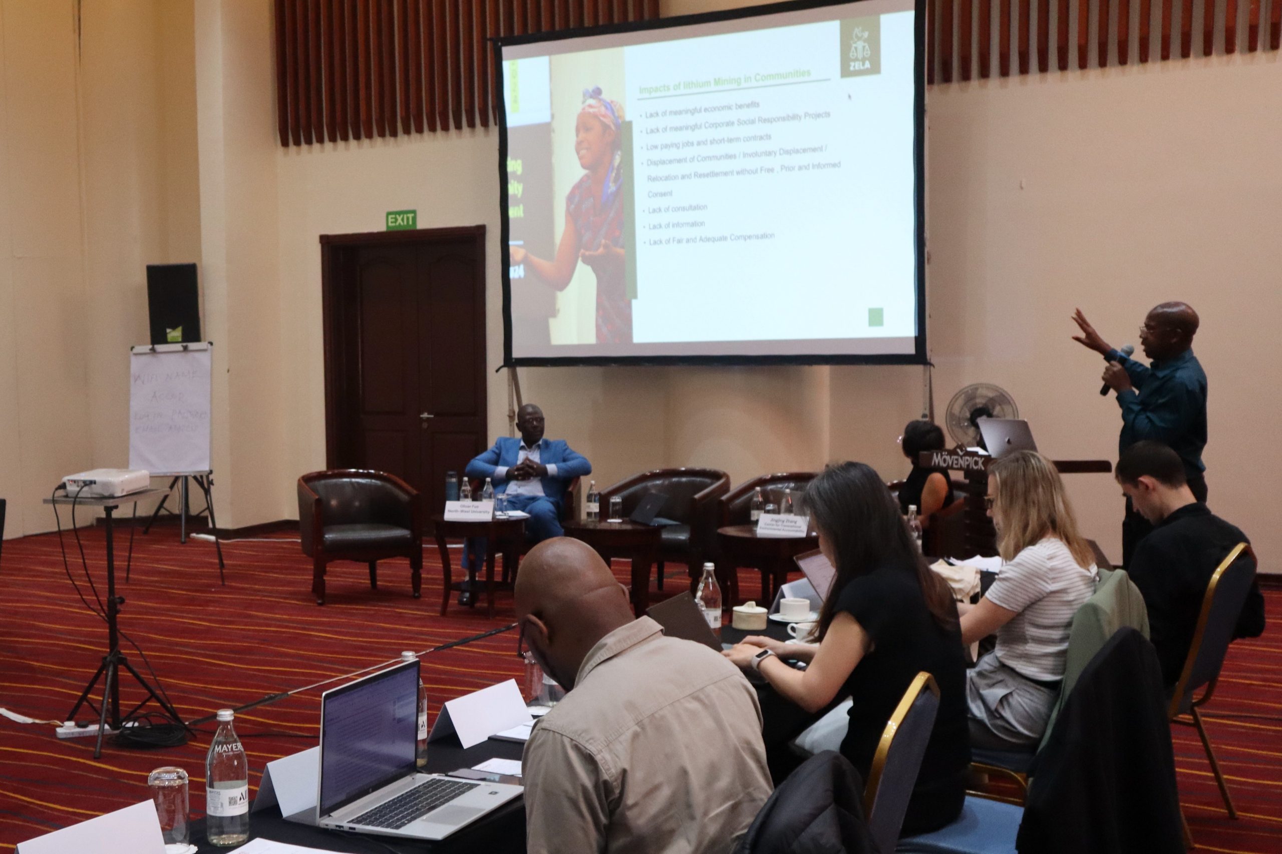 A group of people seated in a room for a workshop